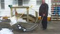 Man with his homemade Wheeled Snow Shovel