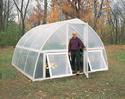 Man standing in Grow-House Greenhouse door