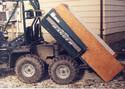 ATV with dump bed equipped with wooden enlargement box