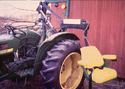 An adult male, safety-belted in the lift chair, is preparing to transfer into the tractor enclosed-cab driverâ€™s seat.