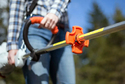Person holding a string trimmer with a Vibration Reducer on it